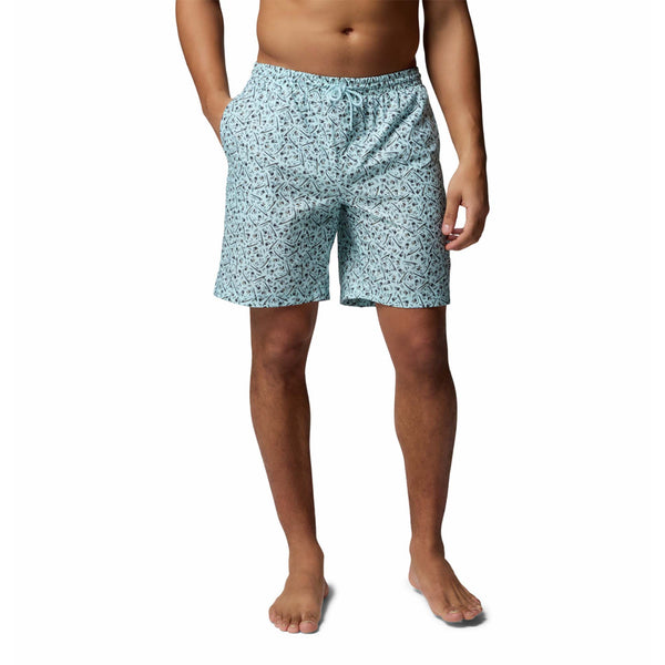  Man wearing light blue patterned swim shorts on a white background
