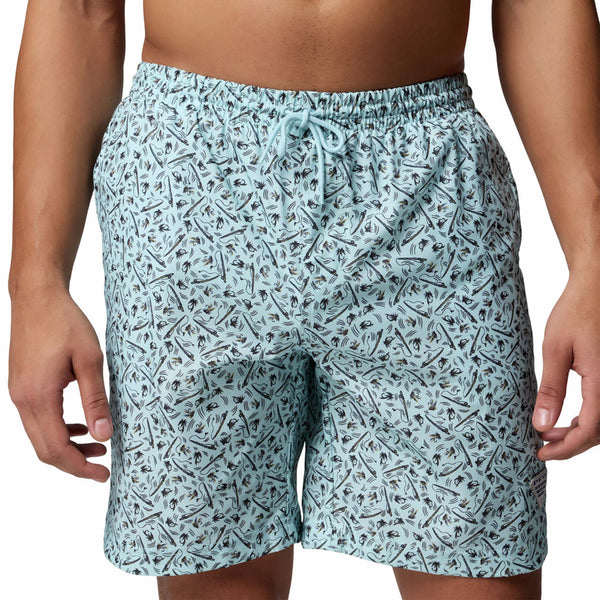  Patterned swim shorts worn by a person on a plain background