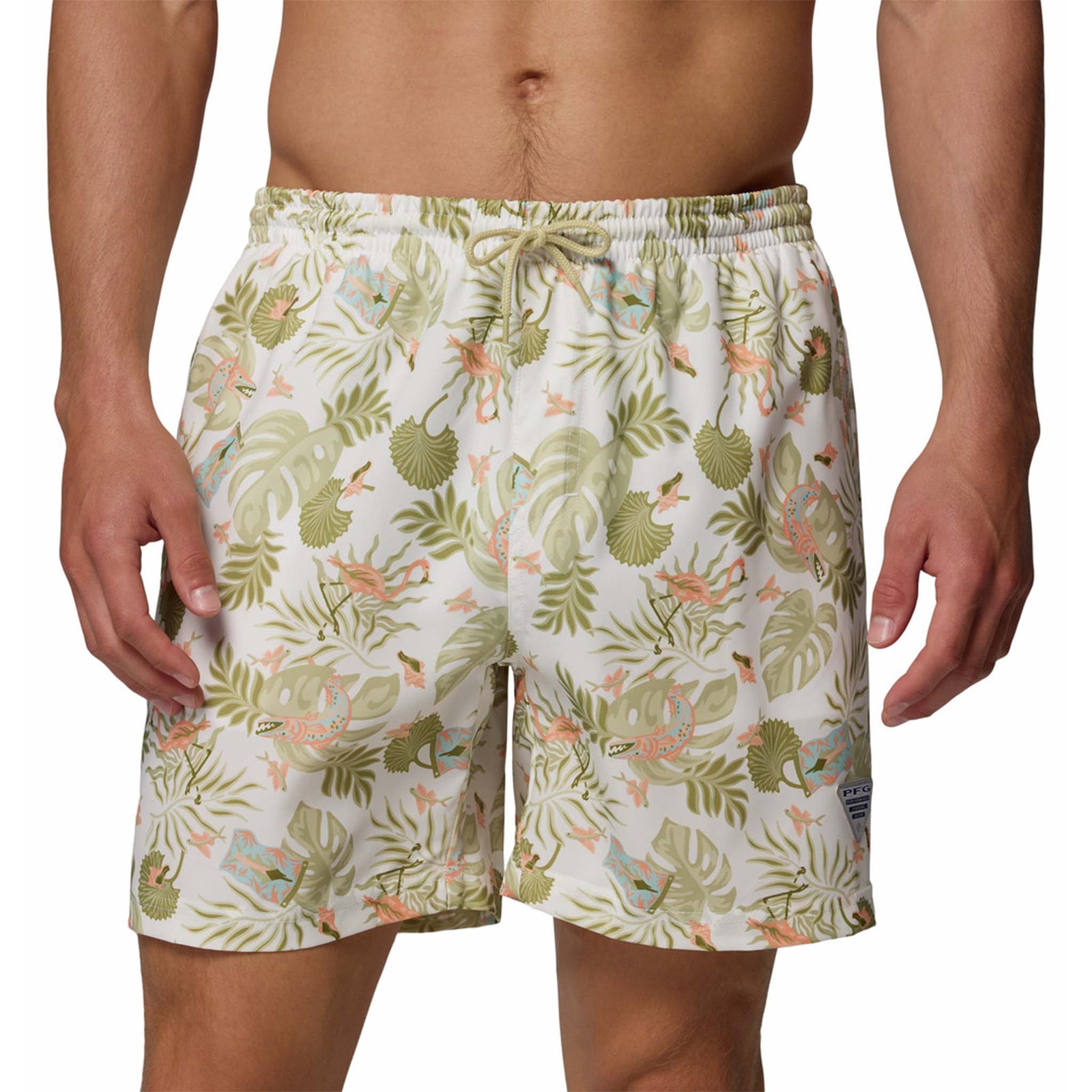 Sea Salt Inagua | Tropical patterned swim shorts worn by a person on a white background