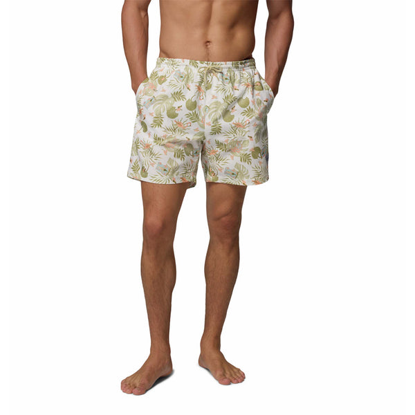  Man wearing a tropical patterned swimsuit on a white background