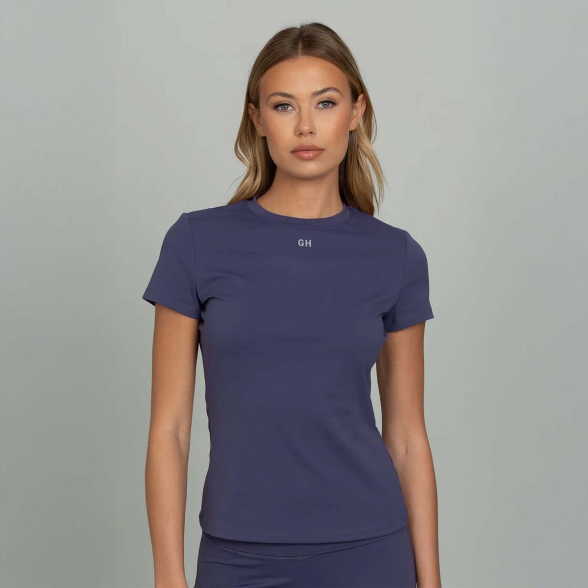 Indigo fitted short sleeve tee with GH logo at chest, close-up front view.