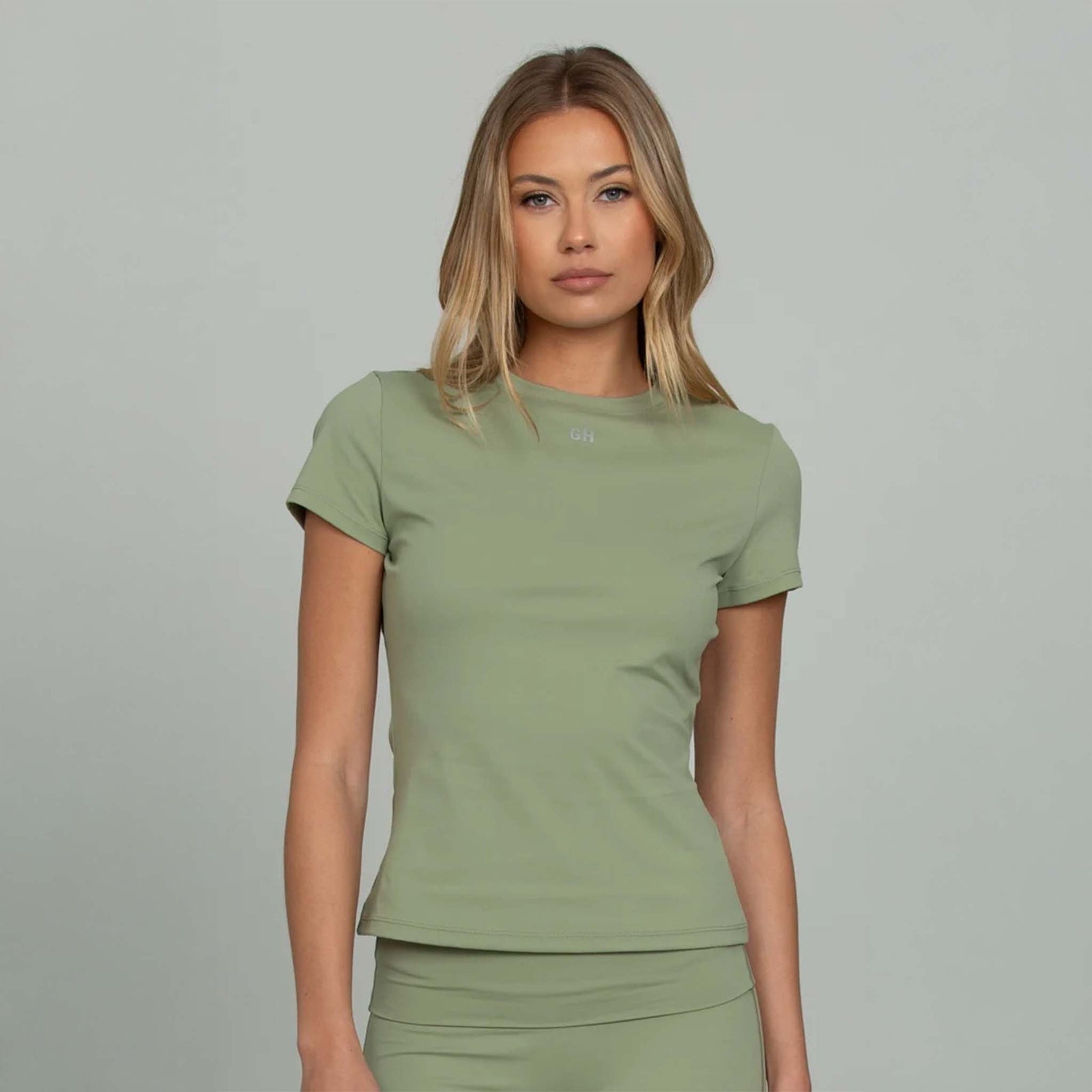 Light green fitted short sleeve tee with GH logo, close-up front view.