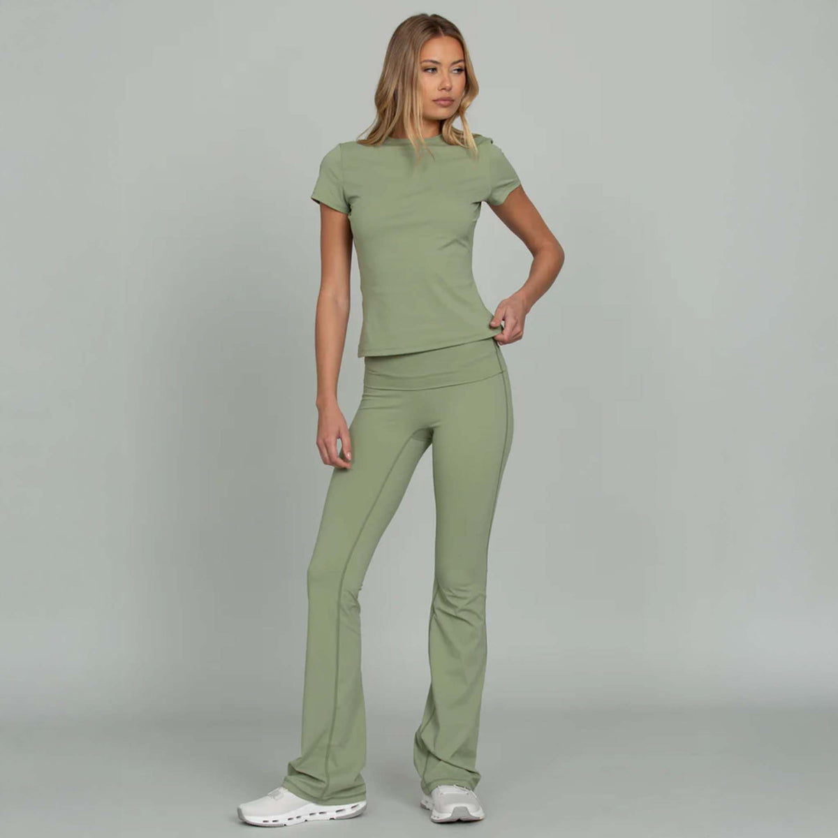 Light green fitted short sleeve tee with crew neckline and matching flare pants, front view full outfit.