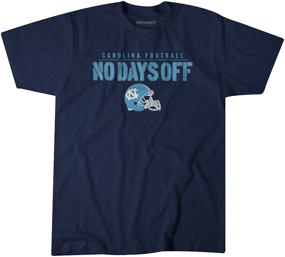Navy North Carolina Tar Heels t-shirt with bold text “No Days Off” above a light blue UNC football helmet graphic and “Carolina Football” lettering.