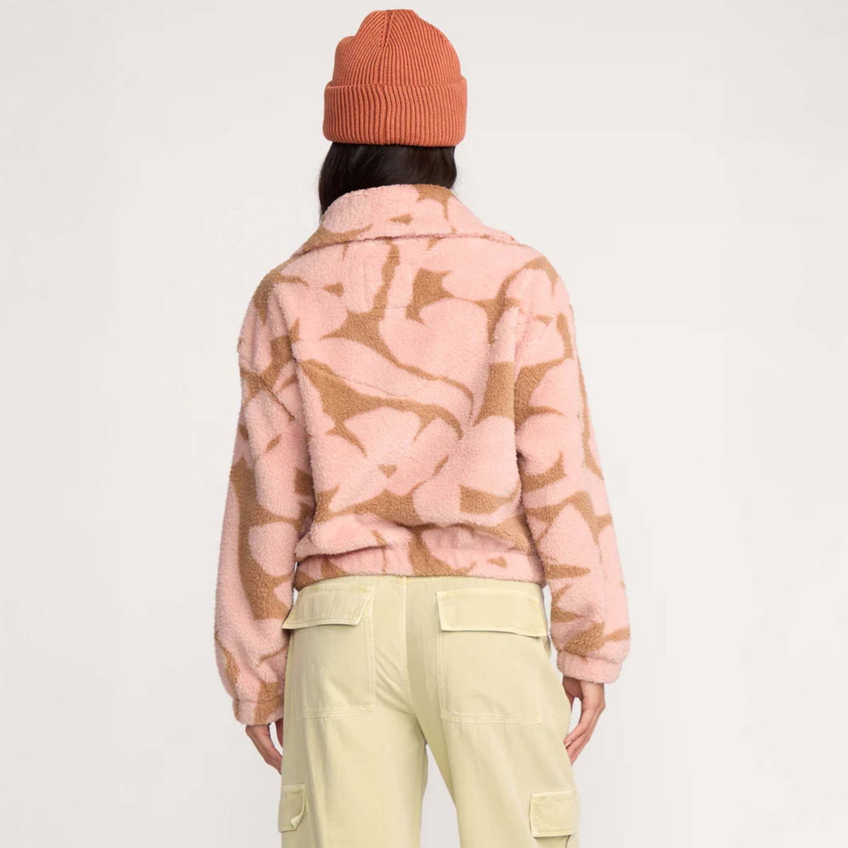 Back view of pink and tan sherpa pullover showing allover abstract print and soft texture.