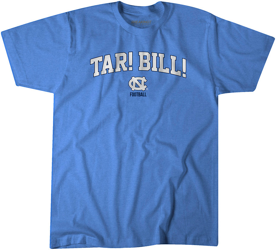 Carolina blue North Carolina Tar Heels t-shirt with bold arched text “Tar! Bill!” above the UNC logo and “Football” lettering on the chest.