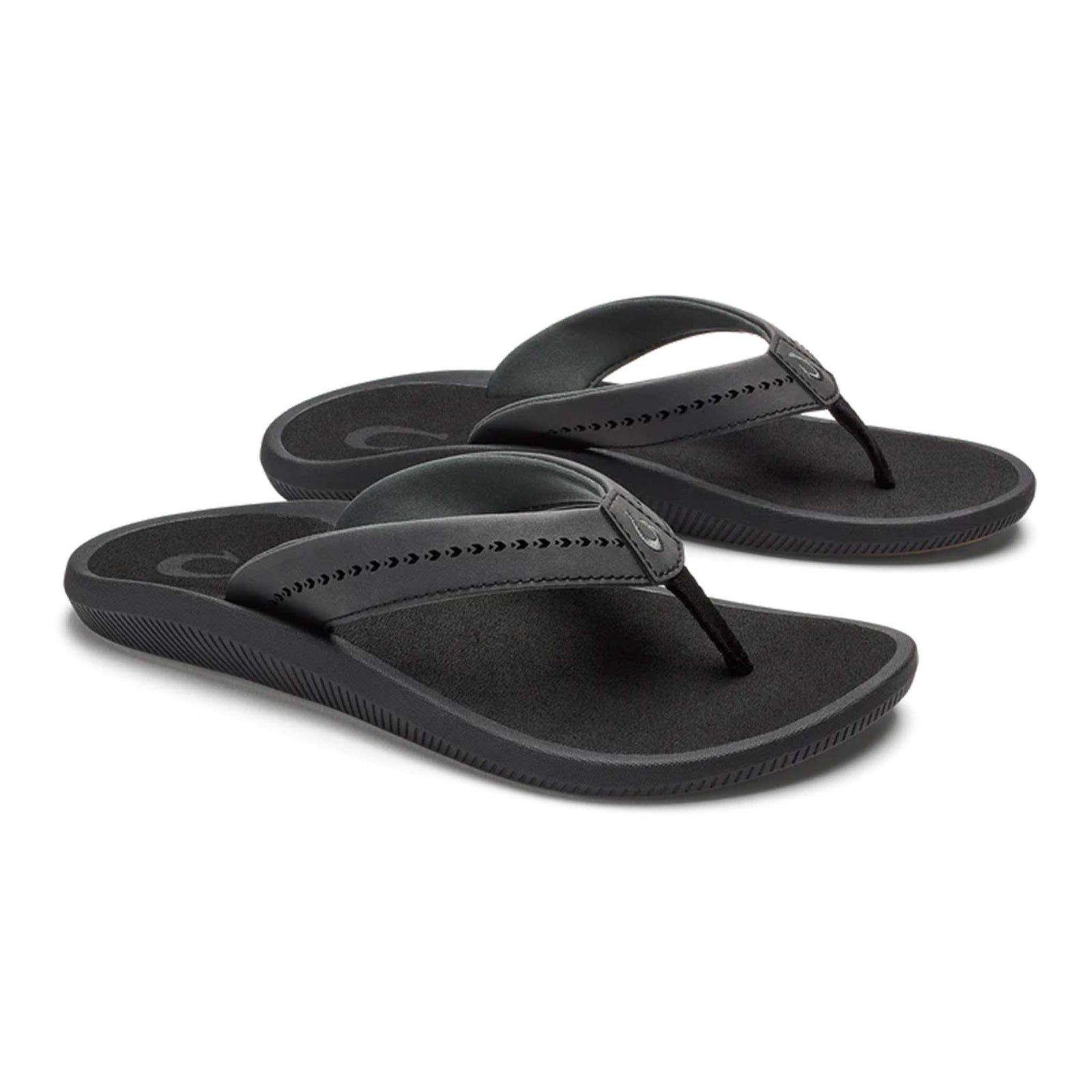 Pair of Olukai Women's Ulele Sandals in Black shown on a white background.
