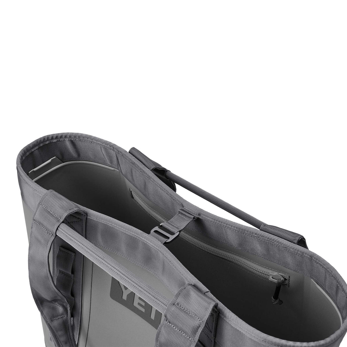 Top view of YETI Camino Carryall 35 in Storm Gray showing hook closure strap and interior zip pocket detail.