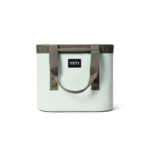 YETI two toned green tote bag shown from the back with the straps down.