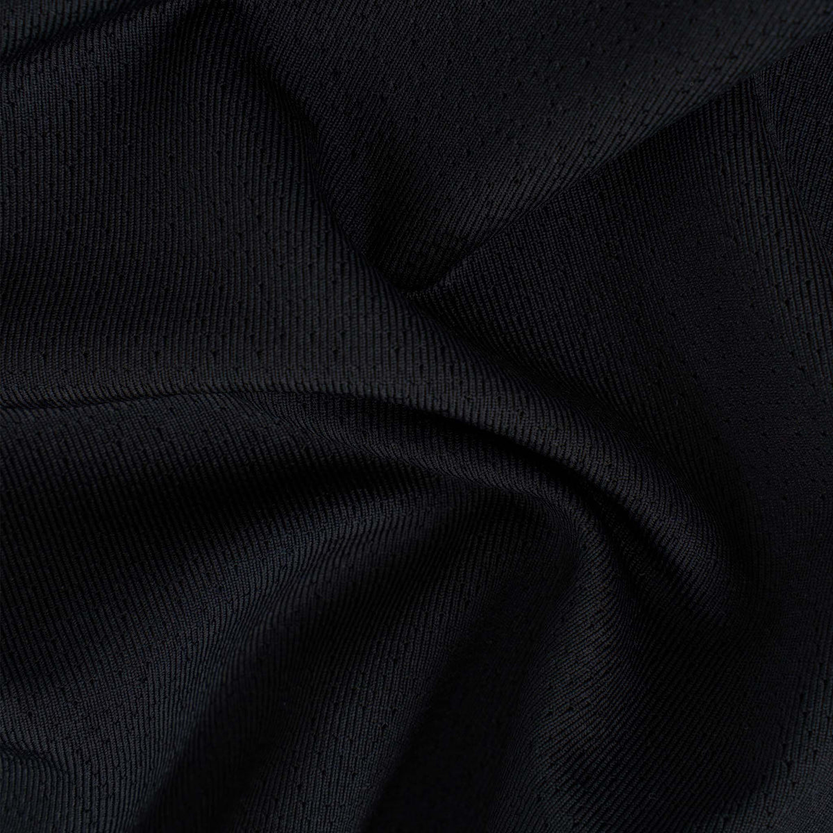 Close-up of black fabric with folds