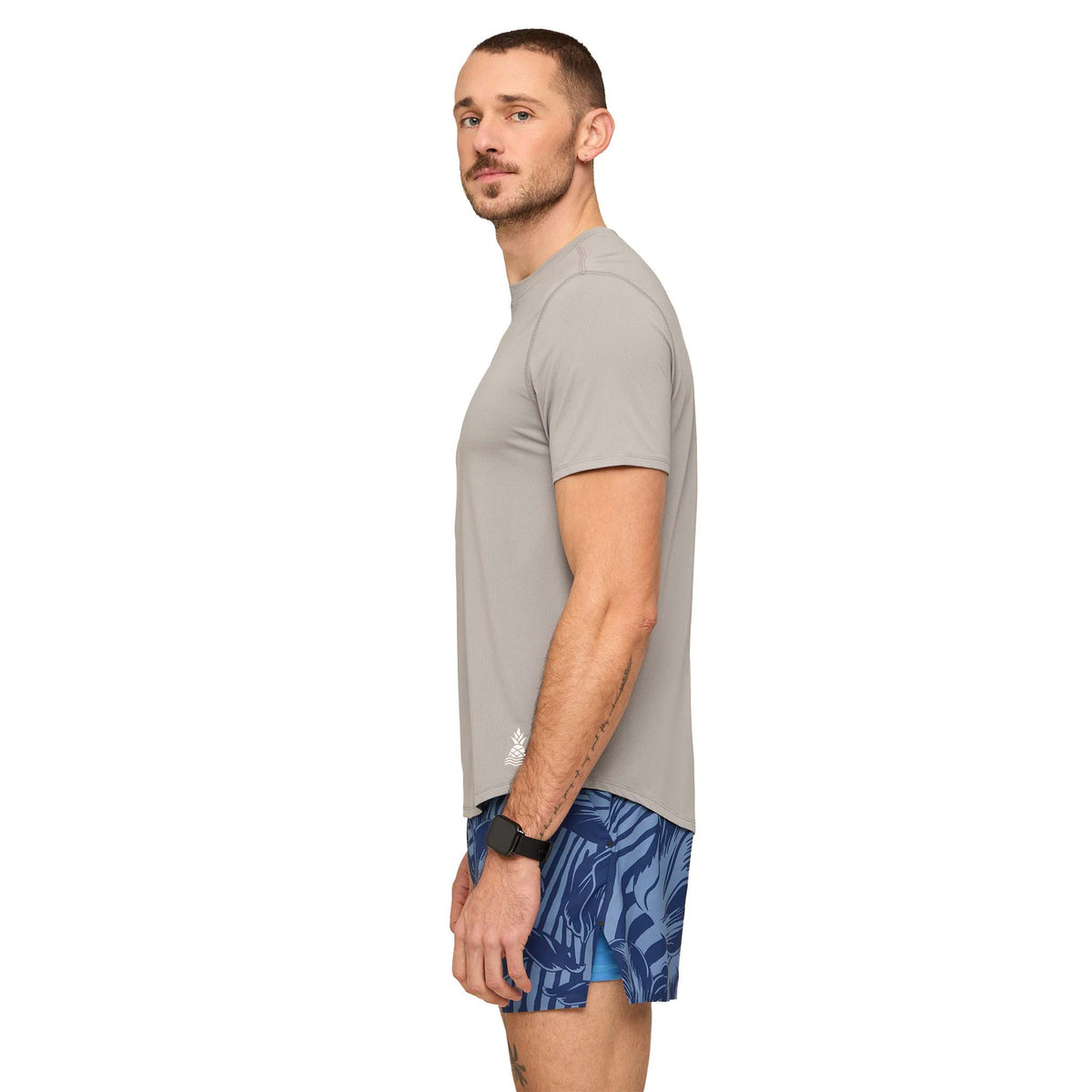 Side view of a Man wearing The Steel Gray Rec Tee with moisture wicking, breathable athletic material