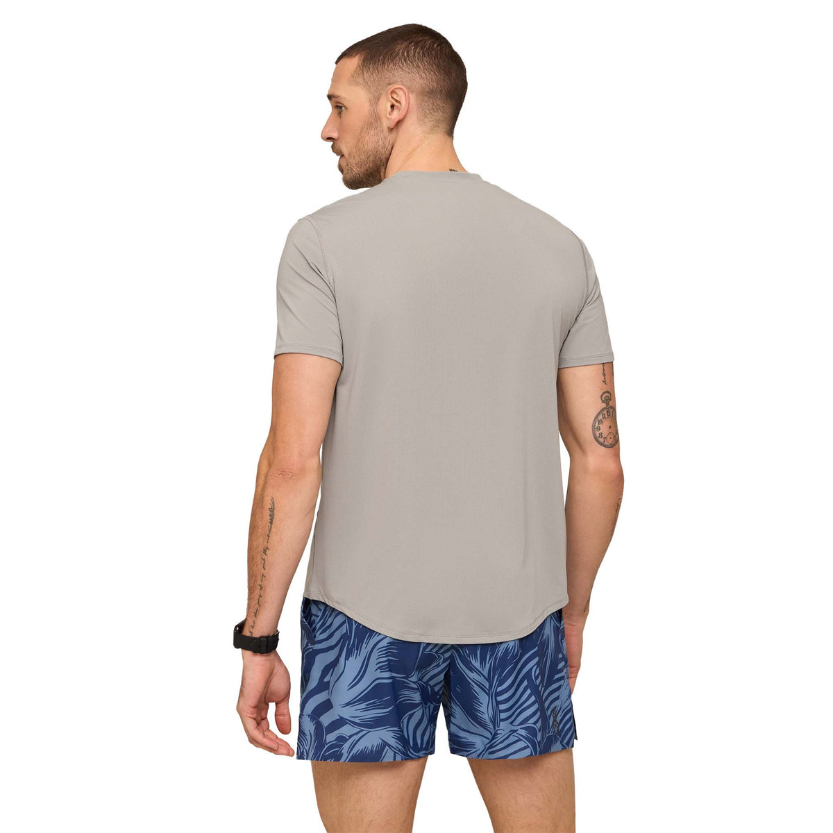 Back view of a Man wearing The Steel Gray Rec Tee with moisture wicking, breathable athletic material