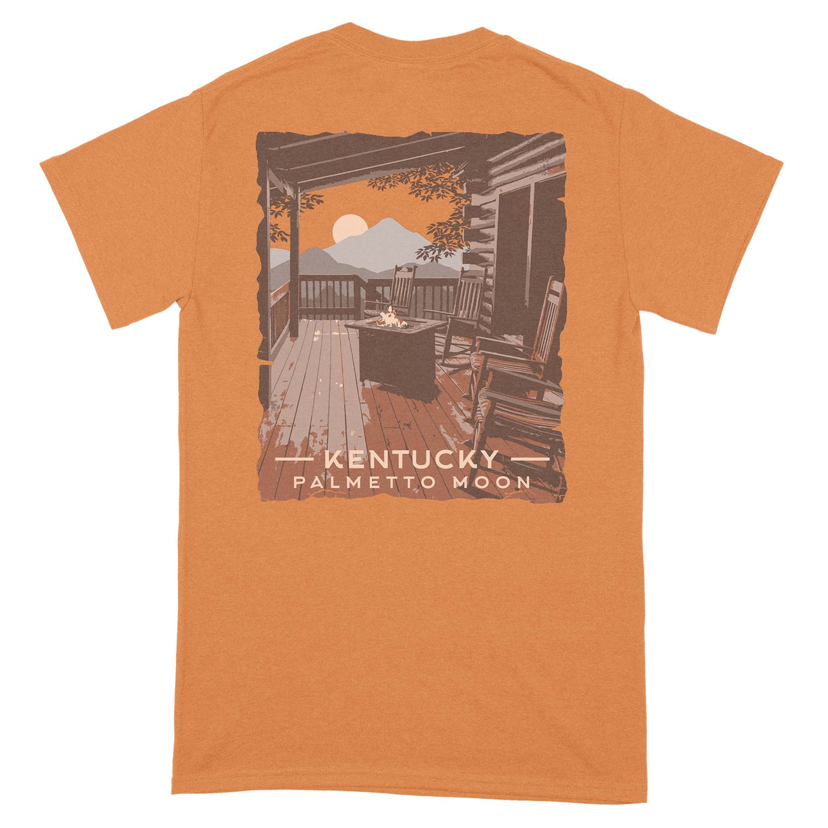 Back view of tangerine Palmetto Moon t-shirt with cabin porch graphic featuring rocking chairs, fire pit, and mountain scene with moon, labeled “Kentucky Palmetto Moon.”
