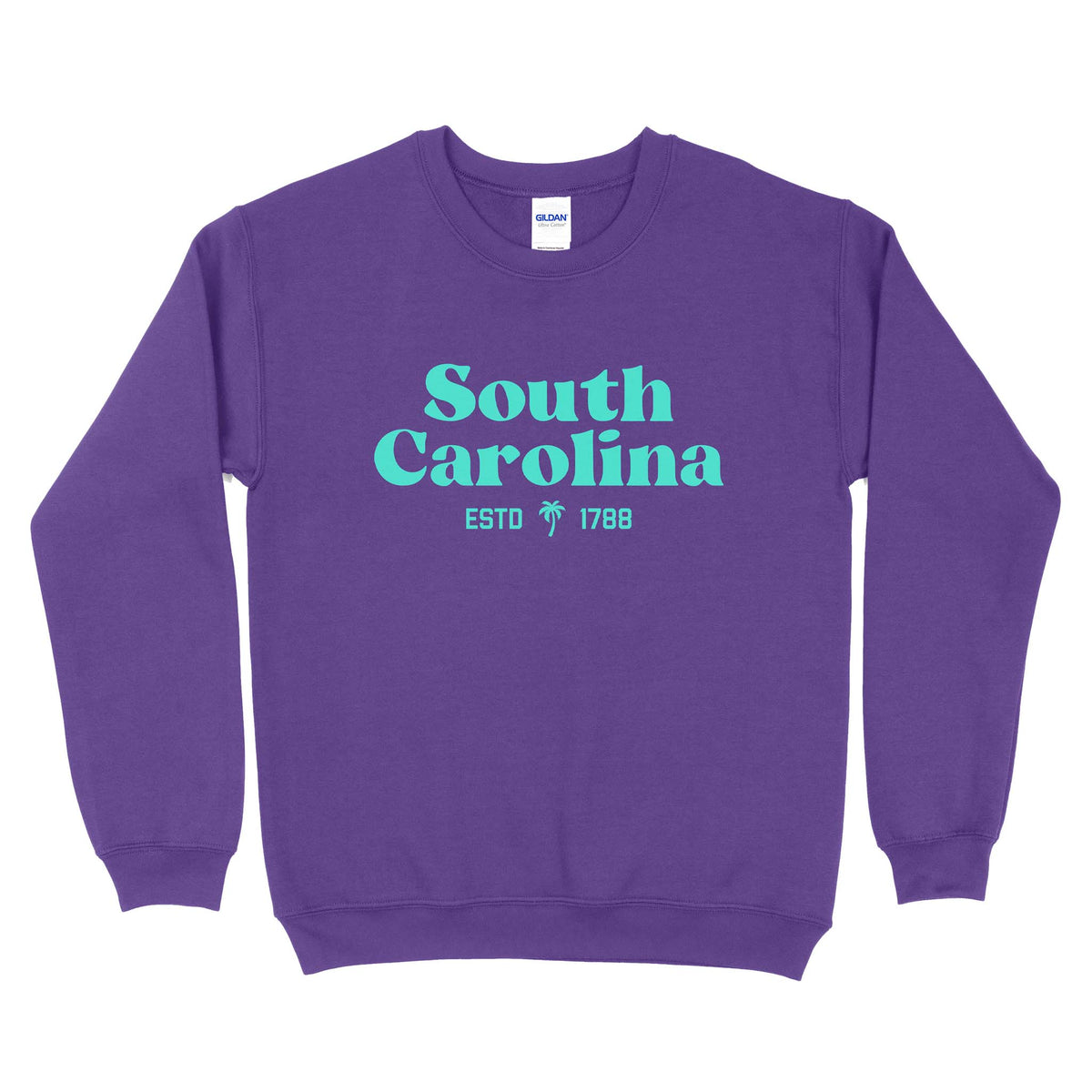 Purple crewneck sweatshirt with aqua “South Carolina ESTD 1788” text and small palm tree graphic printed on front center.