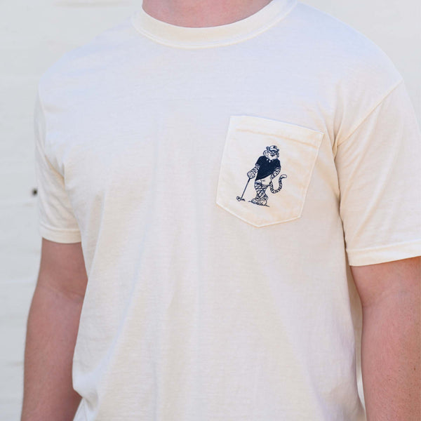 Ivory Auburn University t-shirt with Aubie golf graphic on pocket.