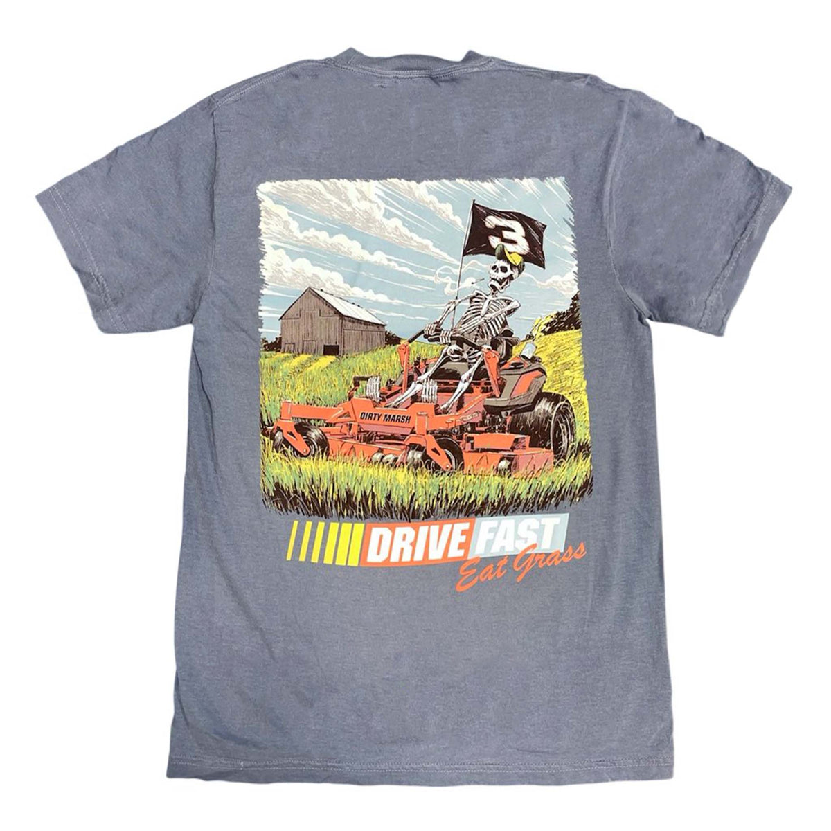 Blue Dirty Marsh t-shirt laid flat showing back graphic of skeleton mowing grass with “Drive Fast Eat Grass” slogan.