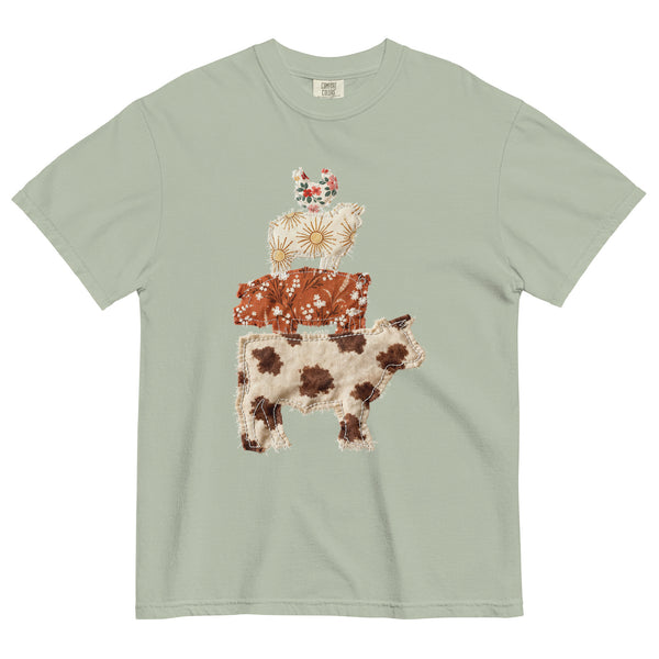 Light green t-shirt with a patchwork farm animal design on a white background
