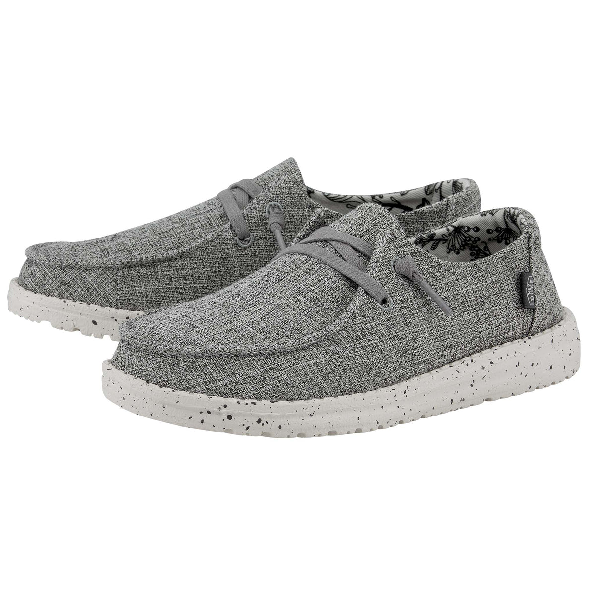 Pair of gray sneakers with speckled sole on a white background