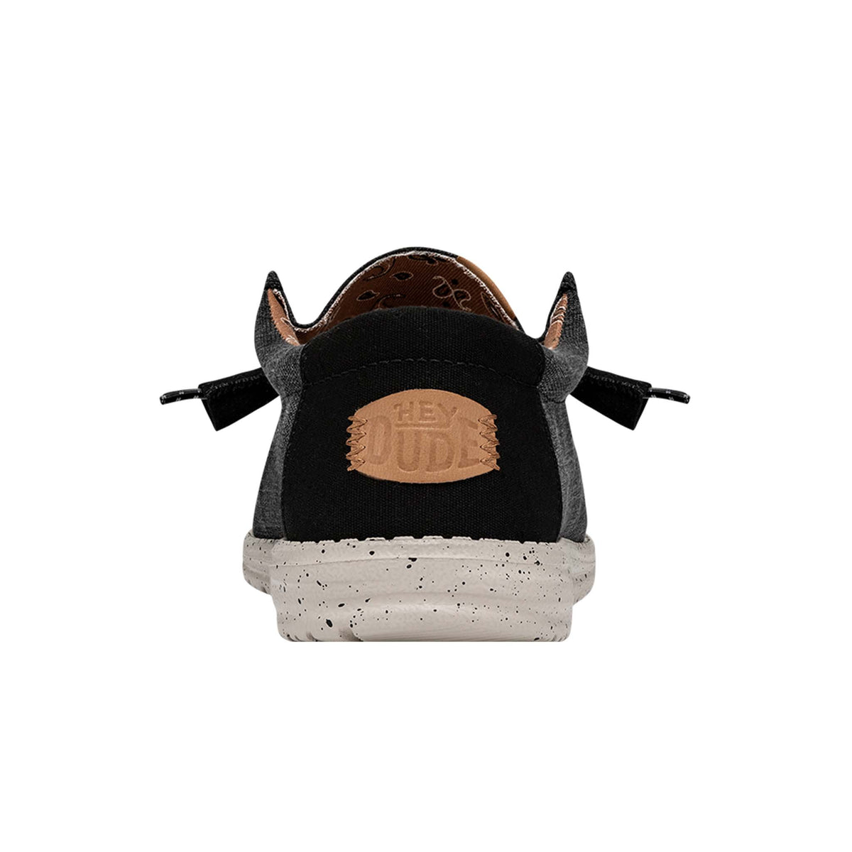 Black sneaker with a visible brand logo on a white background