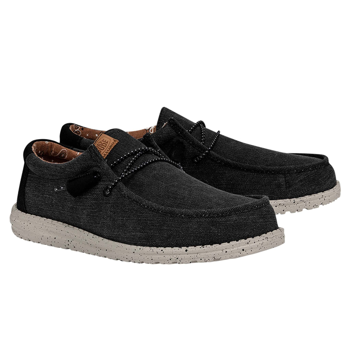 Black casual shoes with gray soles on a white background