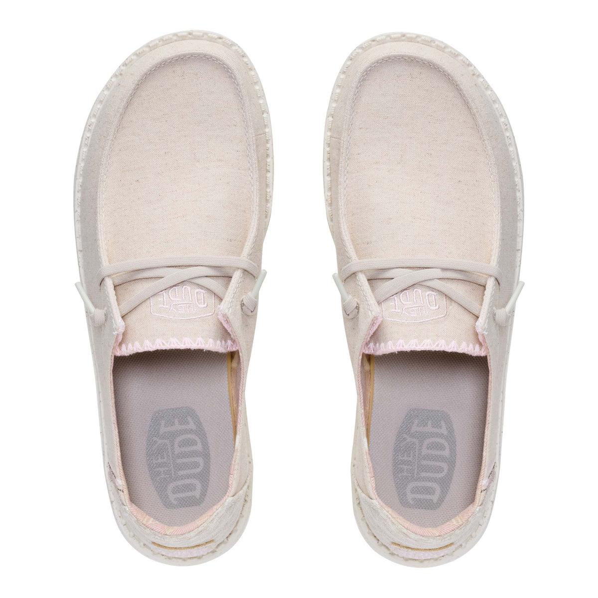 Pair of light pink shoes with brand logo on a white background