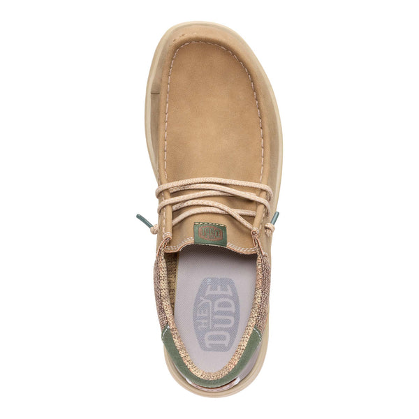 Tan suede shoe with brand logo on a white background