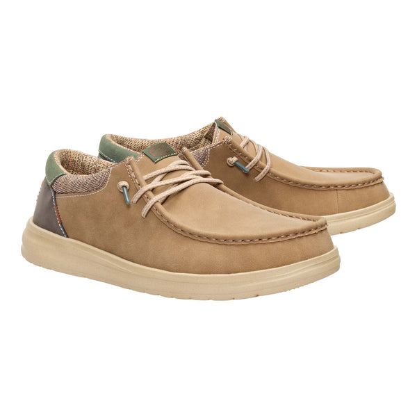 Pair of tan casual shoes on a white background