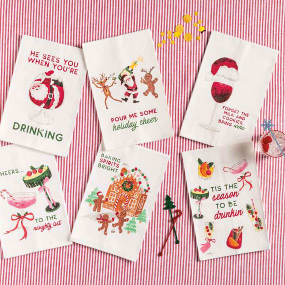 Set of Christmas-themed kitchen towels on a red and white checkered background