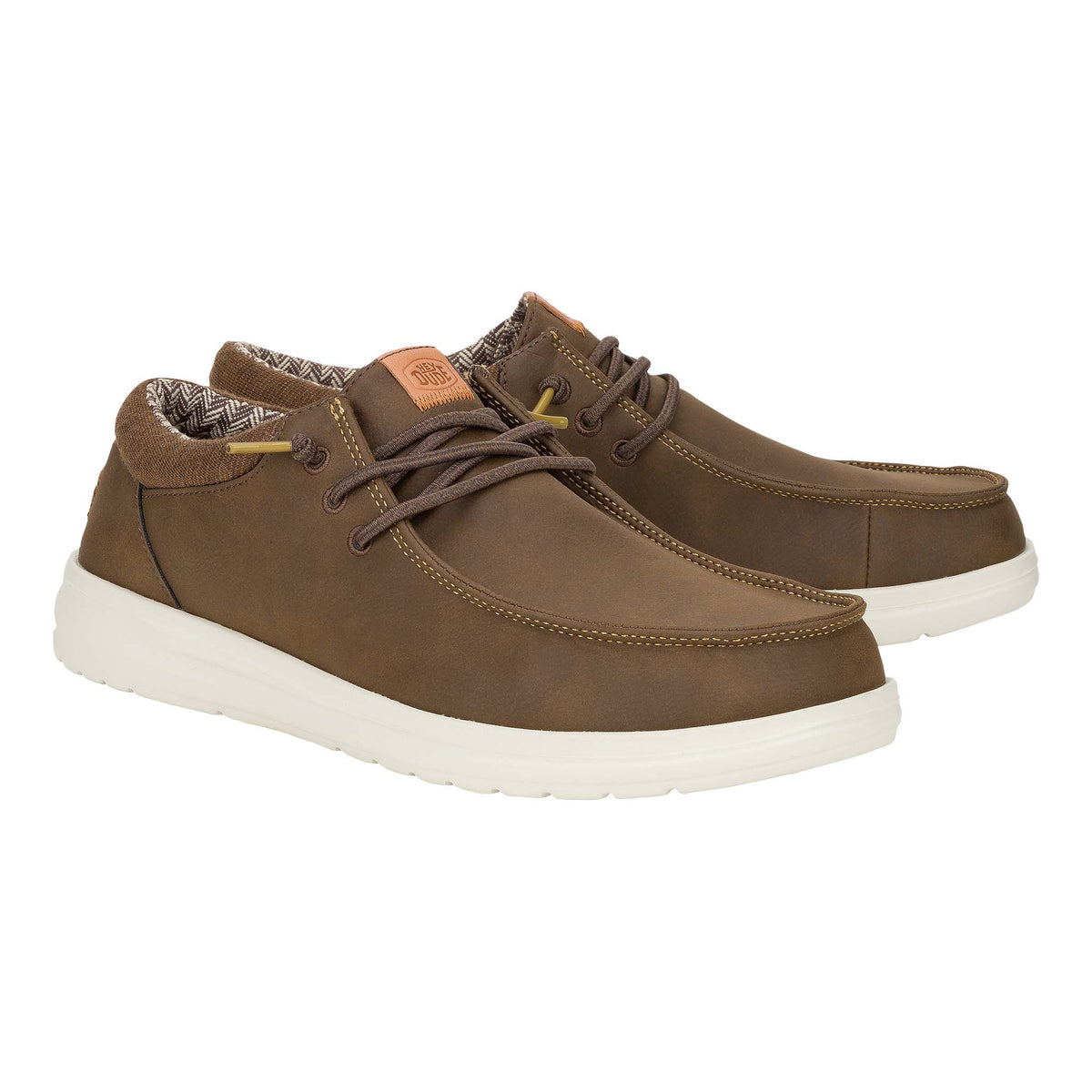 Pair of Hey Dude Paul Classic shoes in brown angled to show outer and inner sides with contrast white soles.