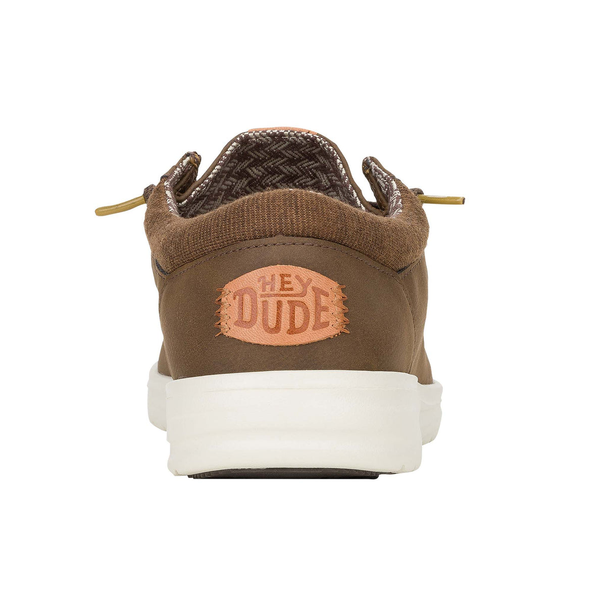 Back view of Hey Dude Paul Classic shoe in brown with tan “Hey Dude” logo patch above white sole.