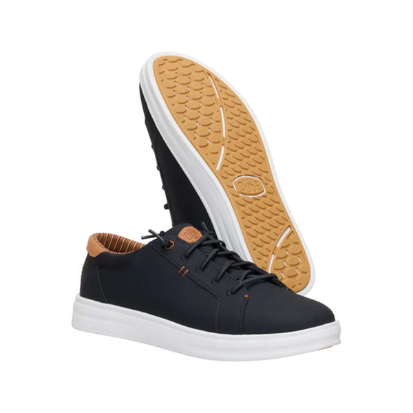 Pair of Hey Dude Paul Pro Classic Shoes in Black with one shoe flipped to show gum rubber sole.