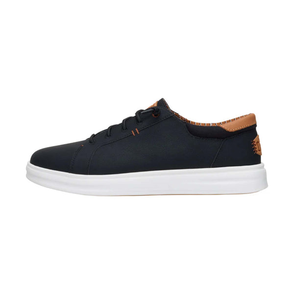Side angle of Hey Dude Paul Pro Classic Shoes in Black with tan collar detail and white outsole.