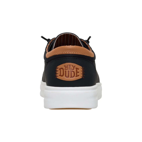 Rear view of Hey Dude Men's Paul Pro Classic Shoes in Black with tan stitched Hey Dude logo patch.