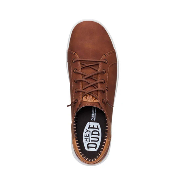 Top-down view of Hey Dude Men's Paul Pro Classic Shoes in Cognac with visible branding and striped lining.