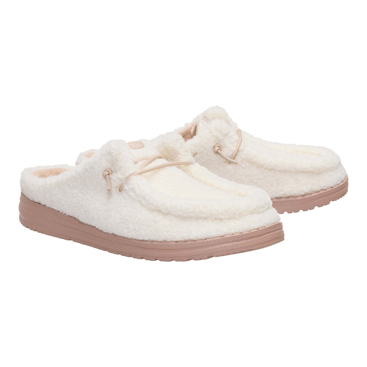 Pair of white fuzzy slippers with beige soles on a white background
