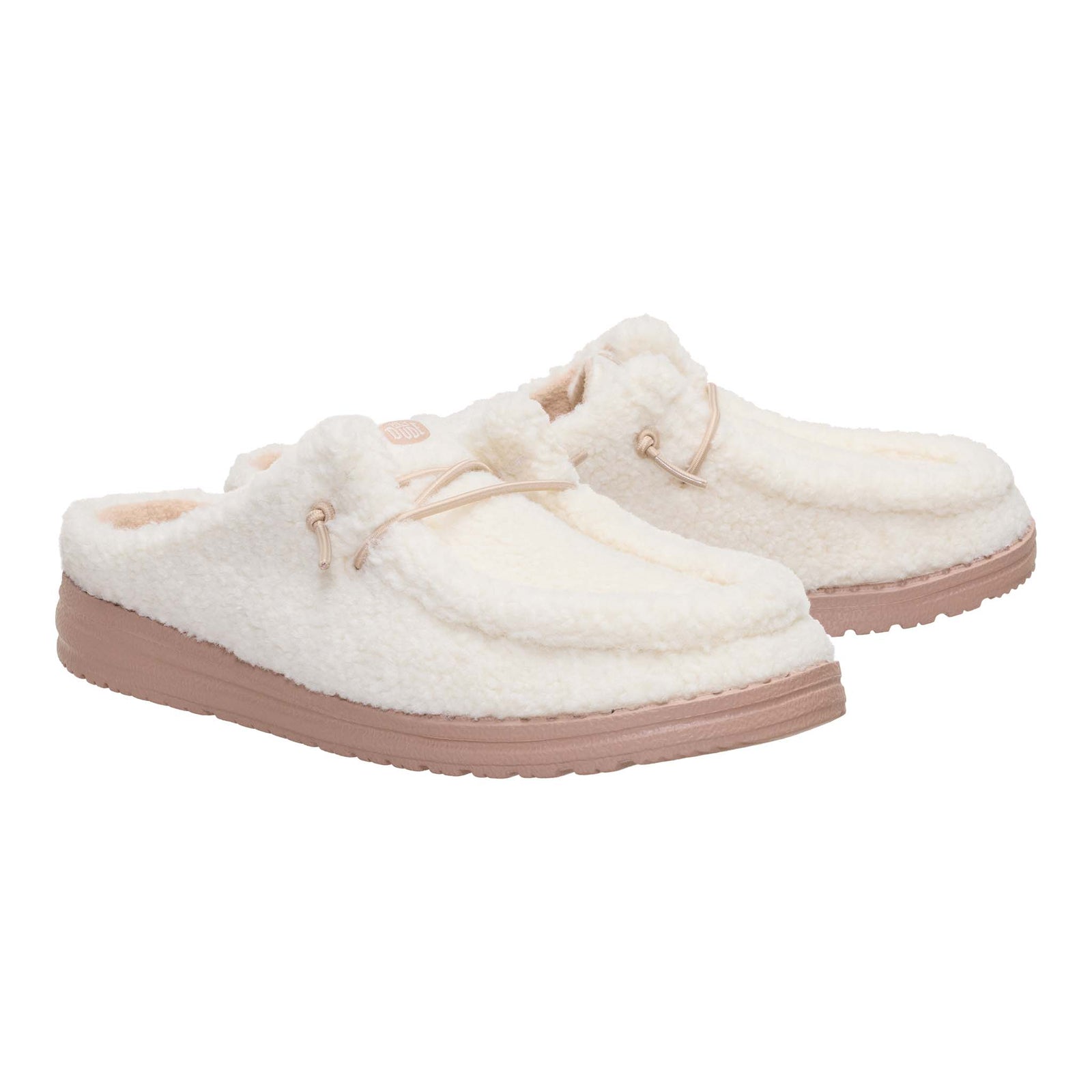 Pair of white fuzzy slippers with beige soles on a white background
