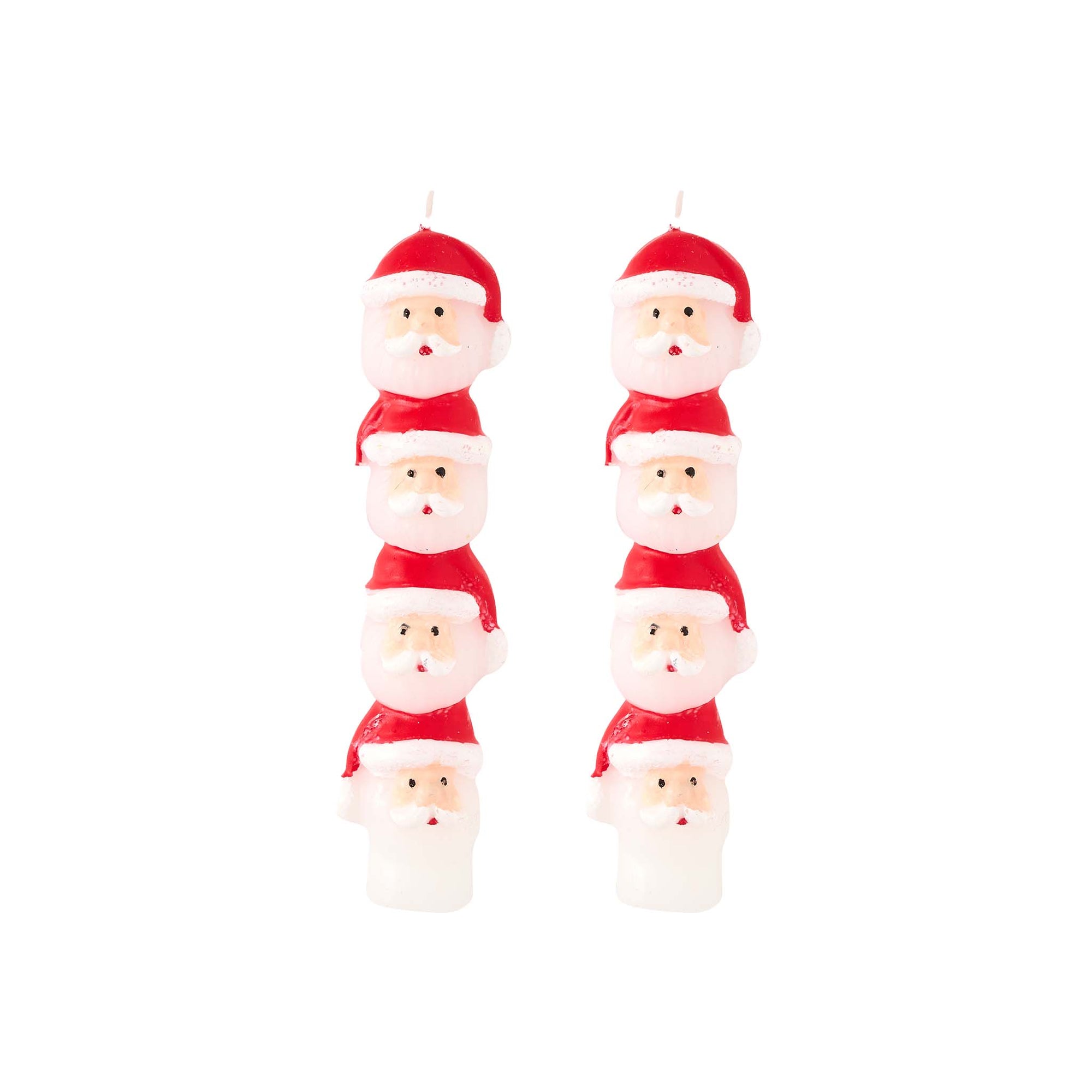 Set of six Santa Claus-shaped candles on a white background