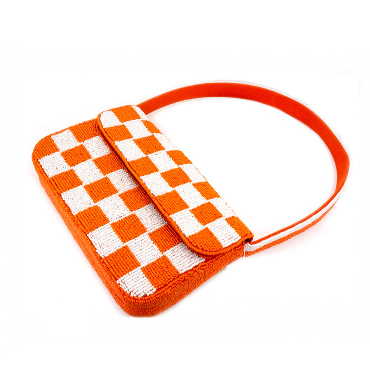 Orange and white beaded checkered handbag with flap closure.