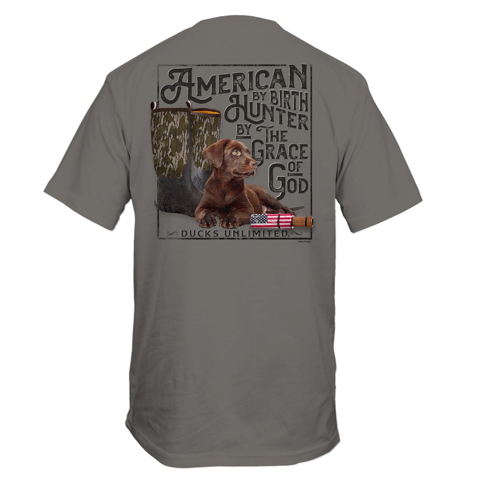 Back view of a grey t-shirt featuring a chocolate lab puppy, camo boots, American flag duck call, and “American by Birth, Hunter by the Grace of God” text.