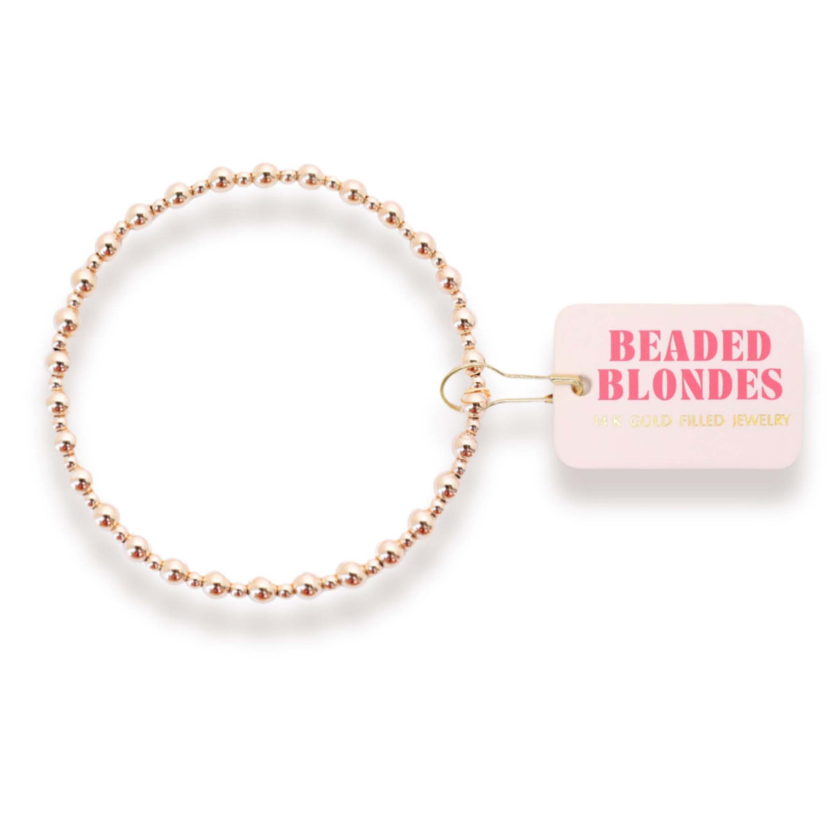 Beaded blonde hair tie with a pink label on a white background