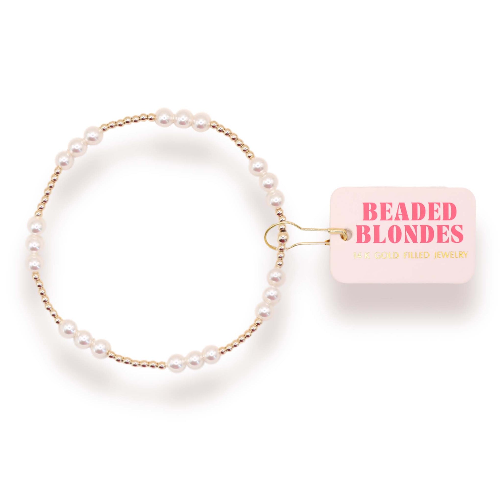 Pearl bracelet with a pink packaging labeled 'Beaded Blondes' on a white background