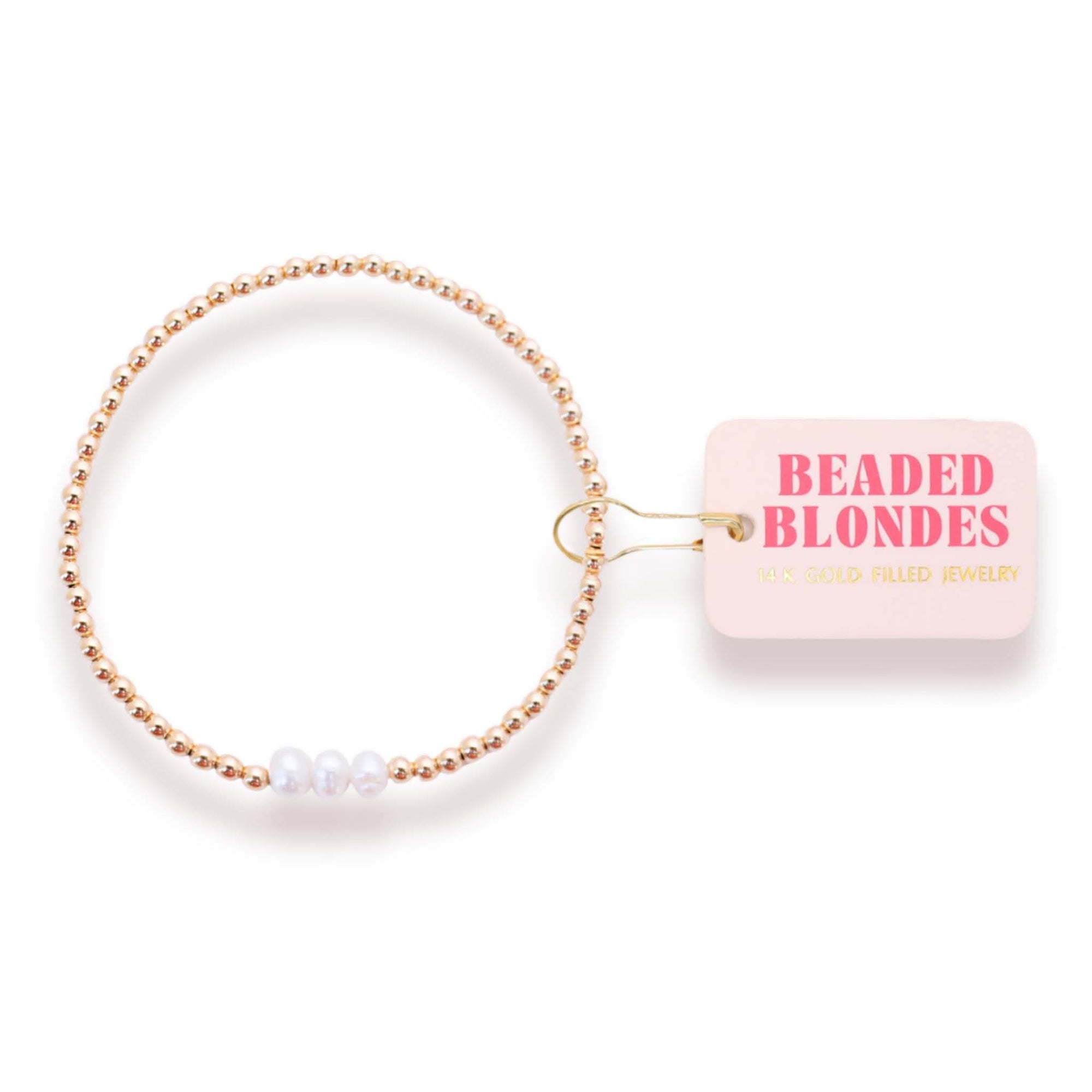 Beaded blonde hair tie with 'Beaded Blondes' packaging on a white background