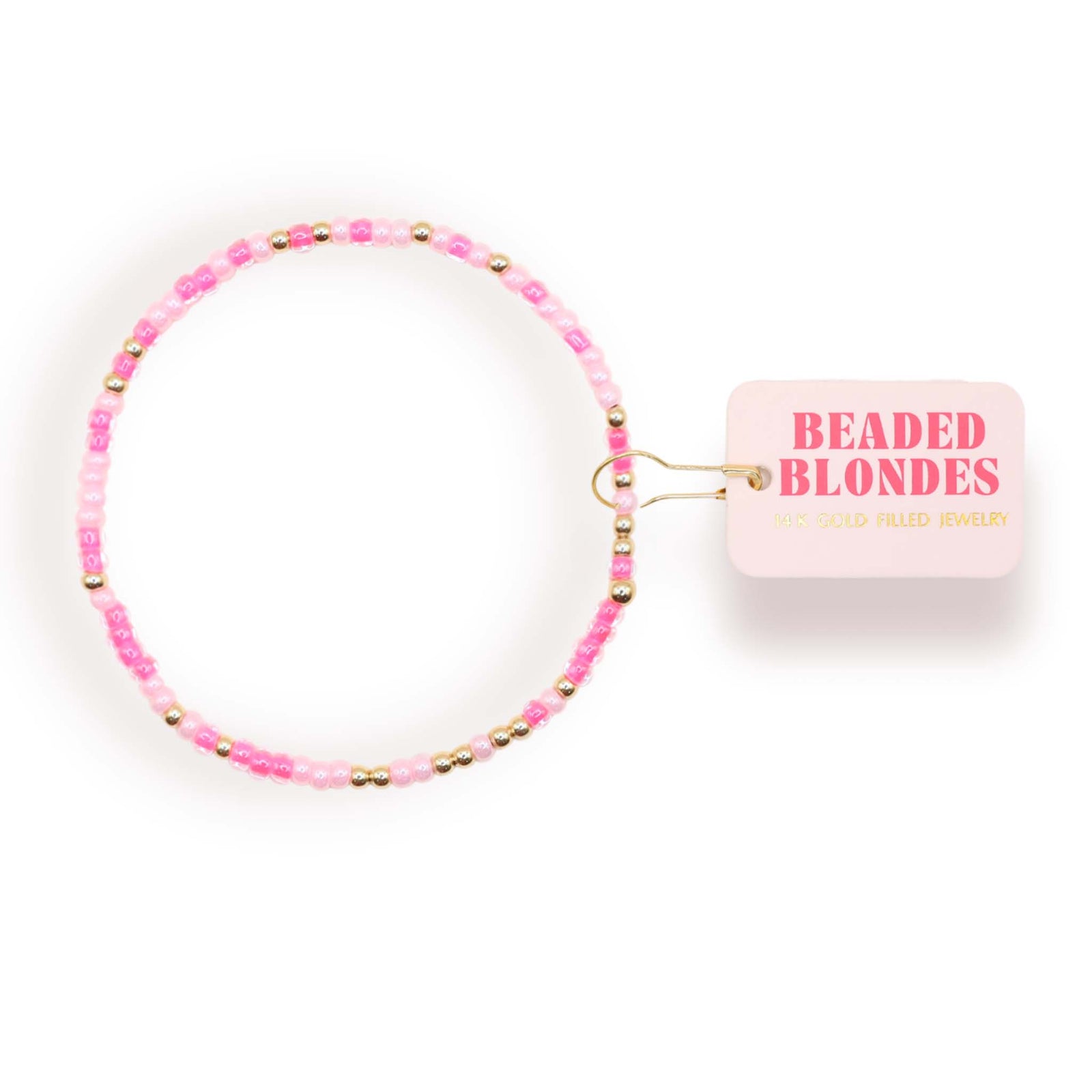 Pink beaded bracelet with 'Beaded Blondes' label on a white background