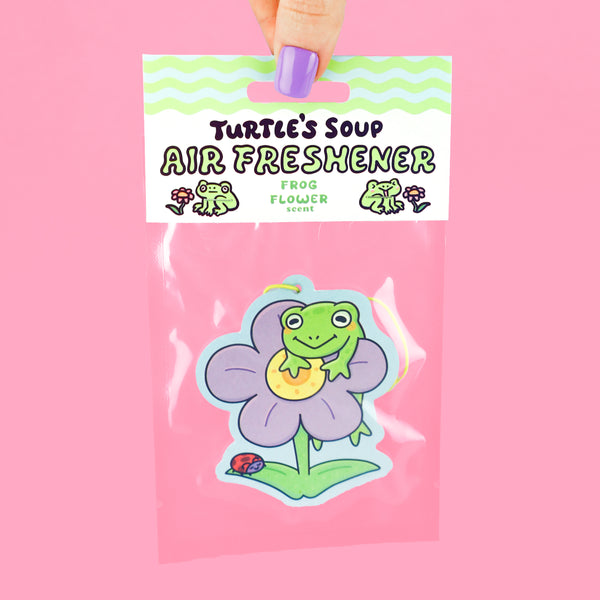 Frog hanging on a flower air freshener
