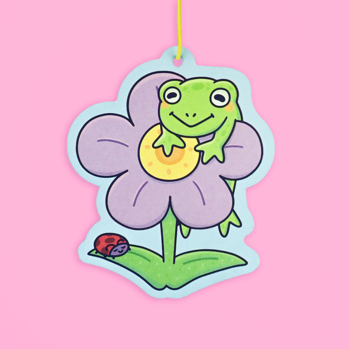 Frog hanging on a flower air freshener