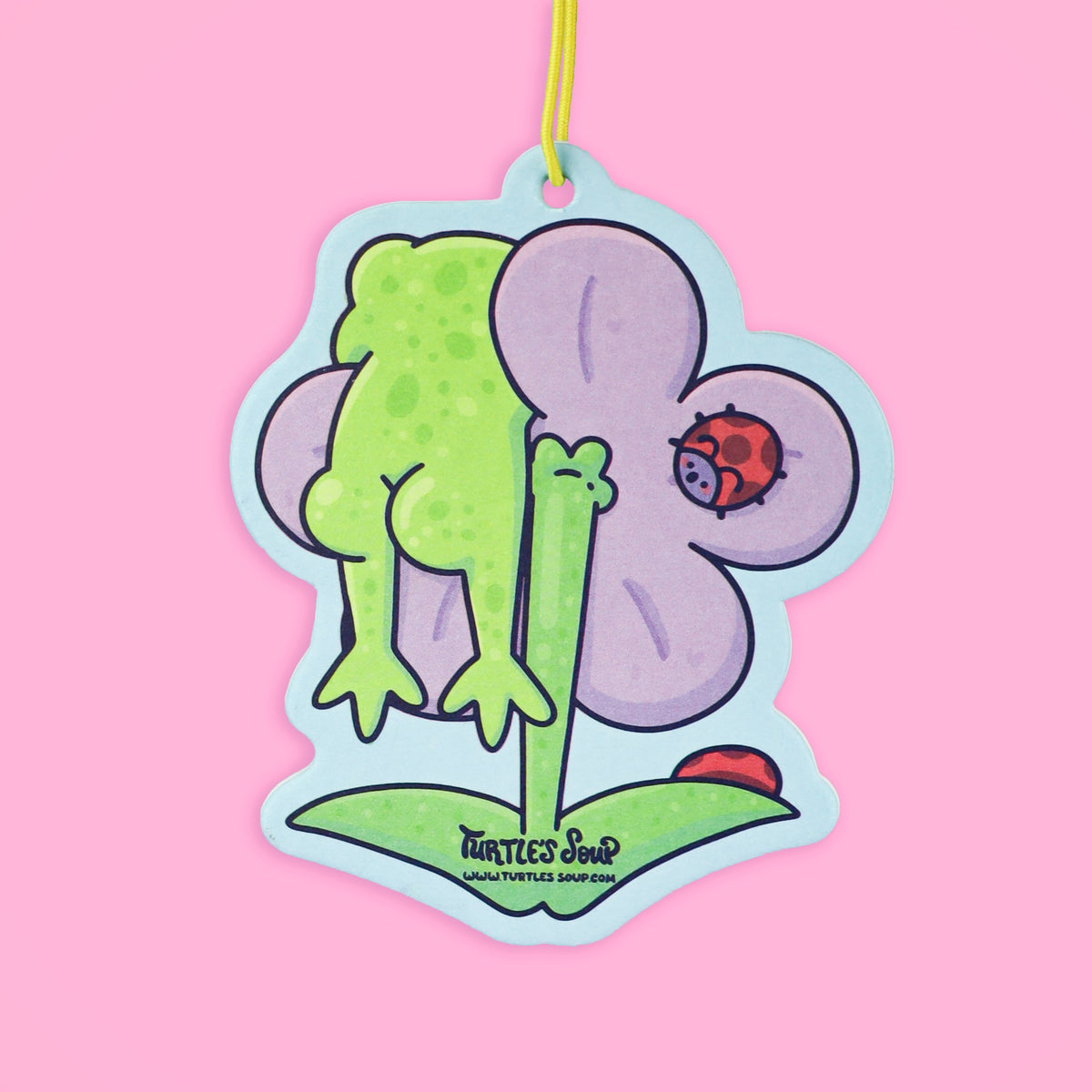Frog hanging on a flower air freshener