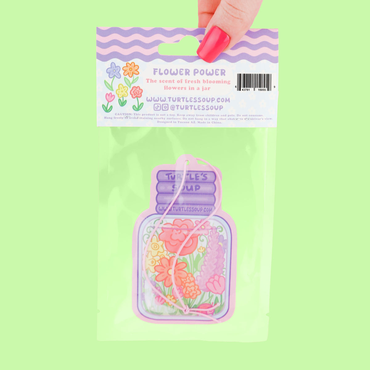 Product packaging with floral design on a green background