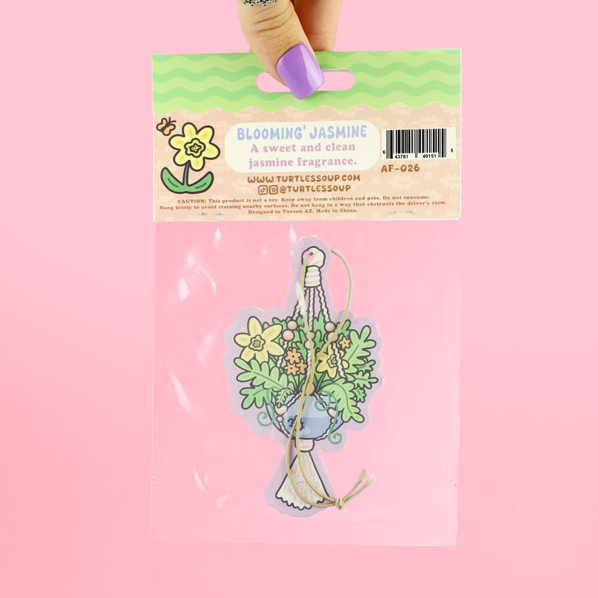 Air freshener packaging with 'Turtle's Soup' branding on a pink background