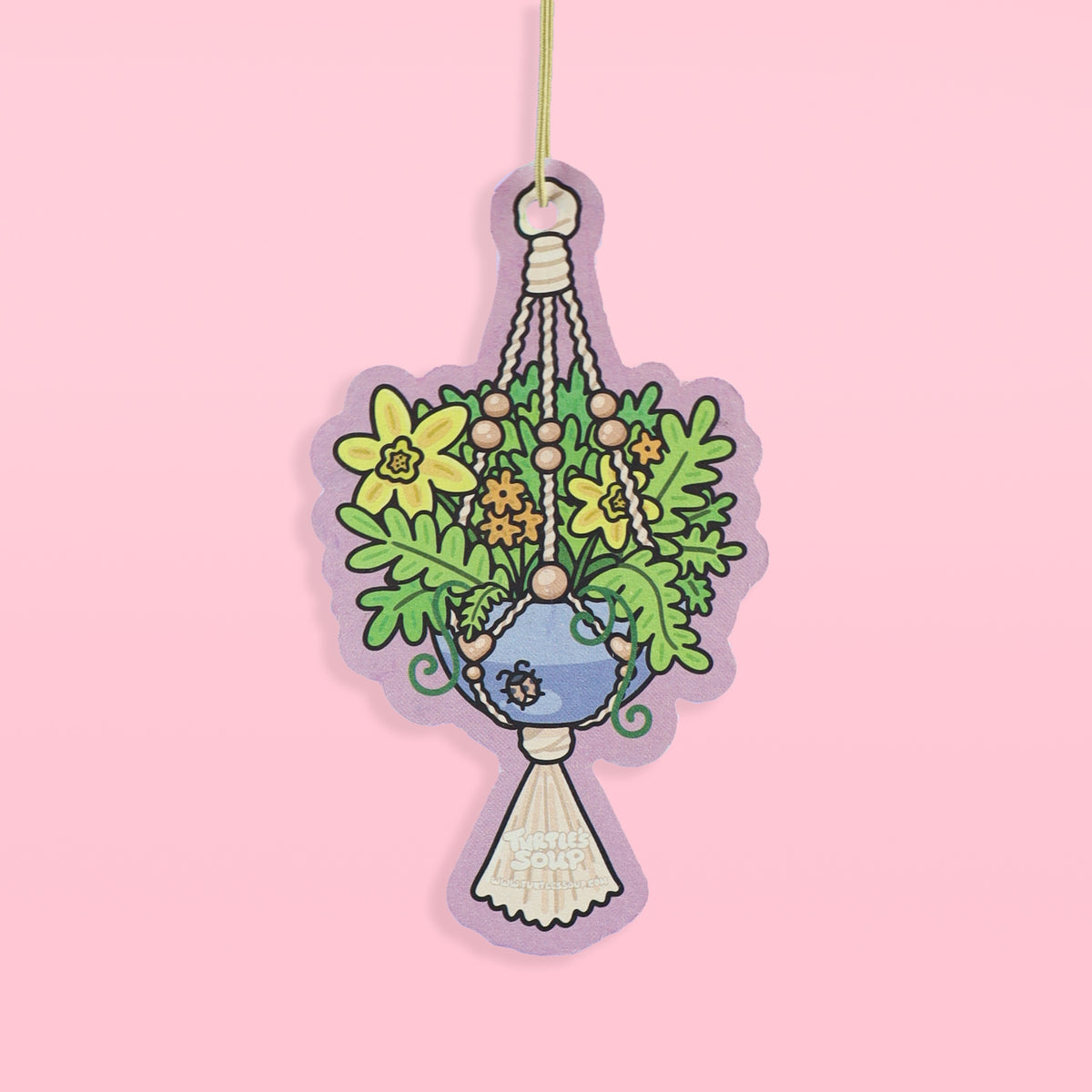 Hanging plant air freshener with flowers on a pink background