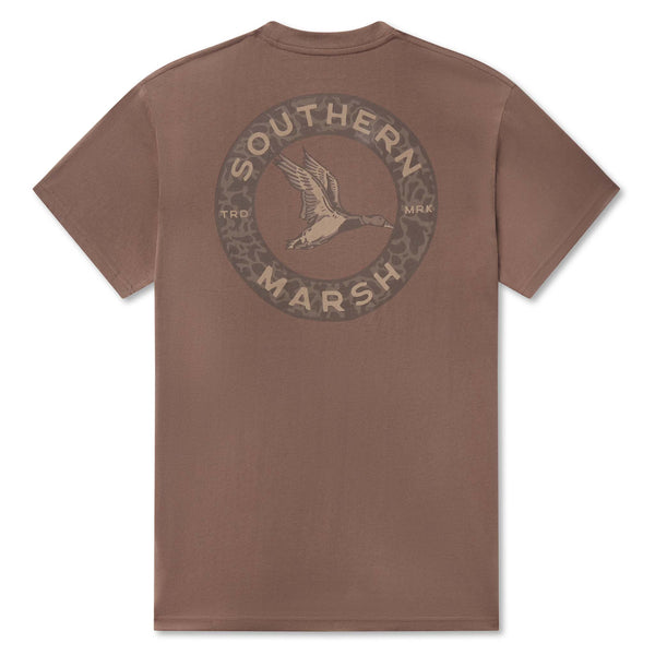 Southern Marsh men’s carajillo brown pocket t-shirt with back graphic of flying duck inside circular camo border with “Southern Marsh” text.